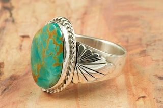 Genuine Manassa Turquoise set in Sterling Silver Ring. This Turquoise is also referred to as King�s Manassa Turquoise. The Manassa Turquoise mine is located in Manassa, Conejos County, Colorado. Created by Navajo Artist Thomas Chischilly. Signed.
